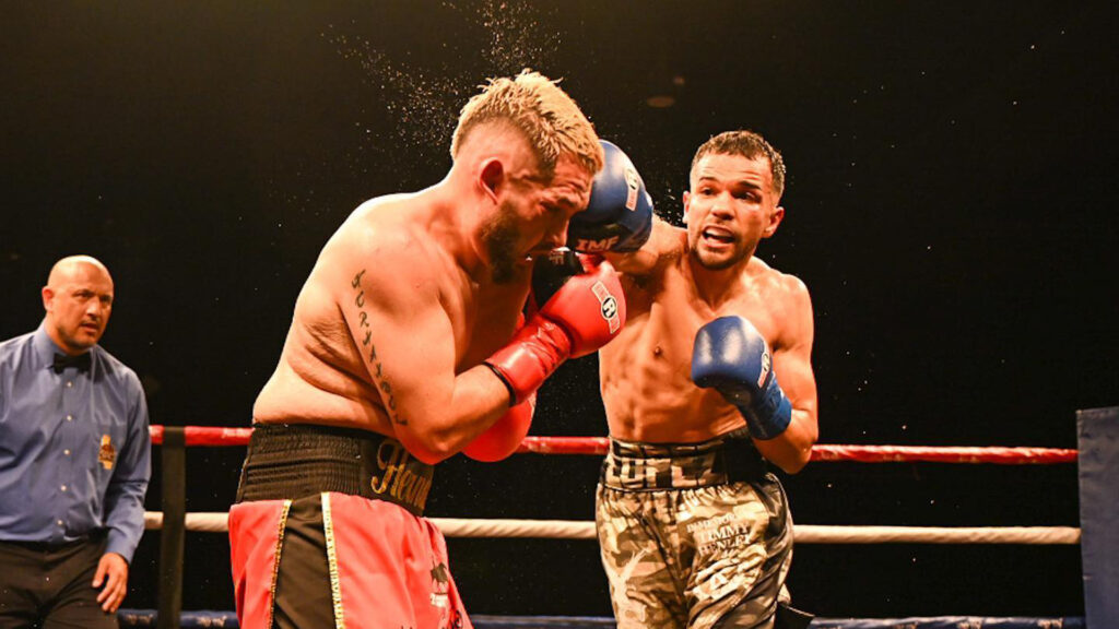 Kenny Lopez lands a right on Tony Hernandez