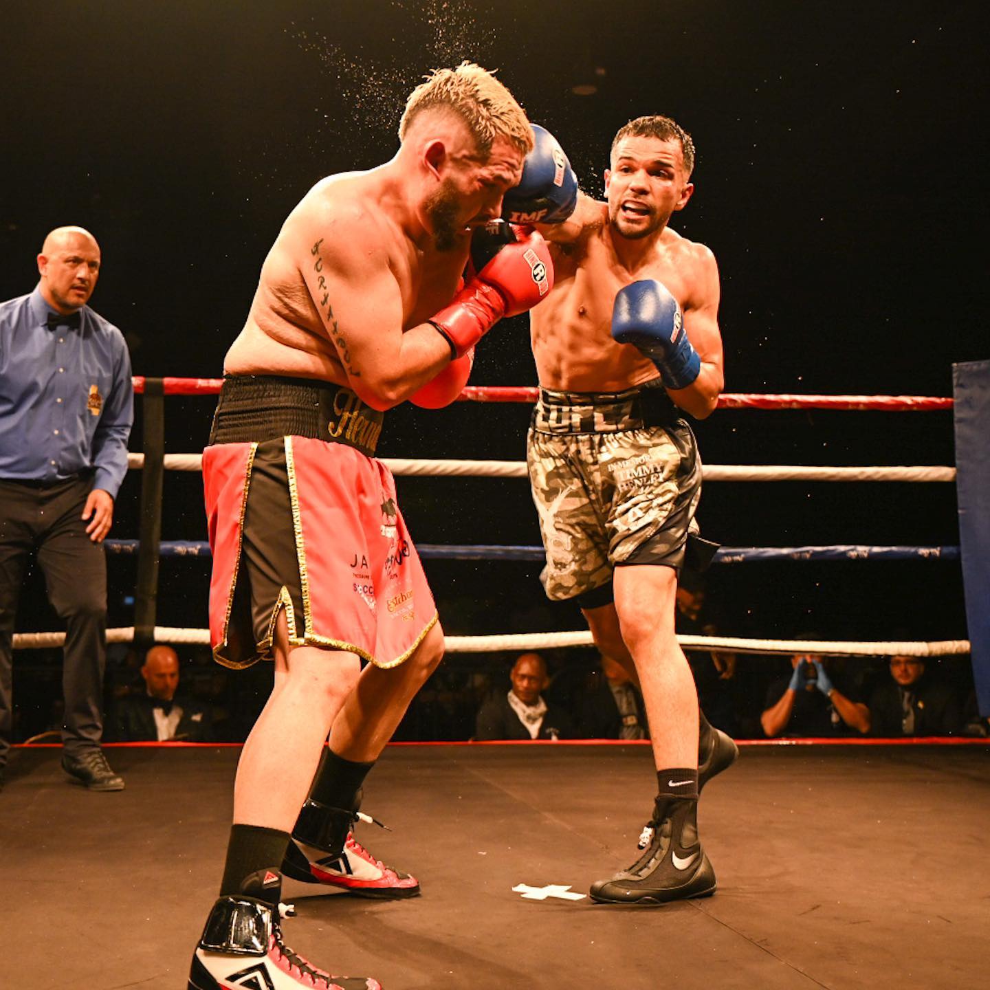 Kenny Lopez lands a right on Tony Hernandez