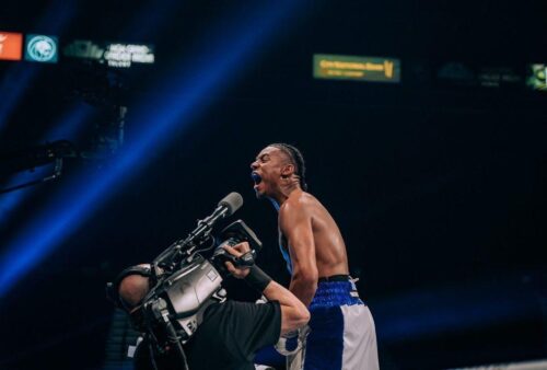 Amari Jones celebrates a victory in the ring.